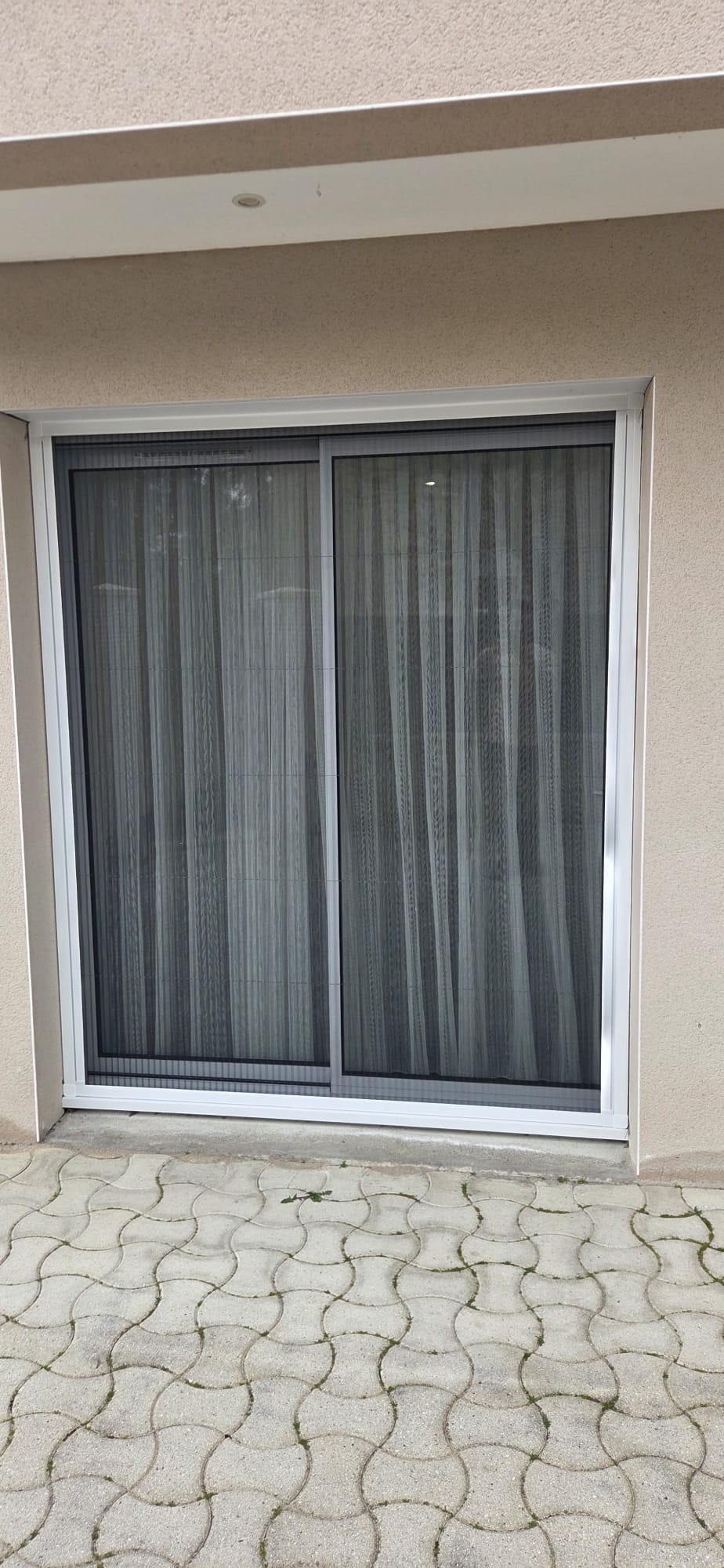 Moustiquaire sur mesure pour baie vitrée à ouverture double sens
